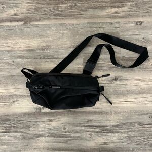 Aer City Sling -  Black Crossbody Belt Bag with Adjustable Strap